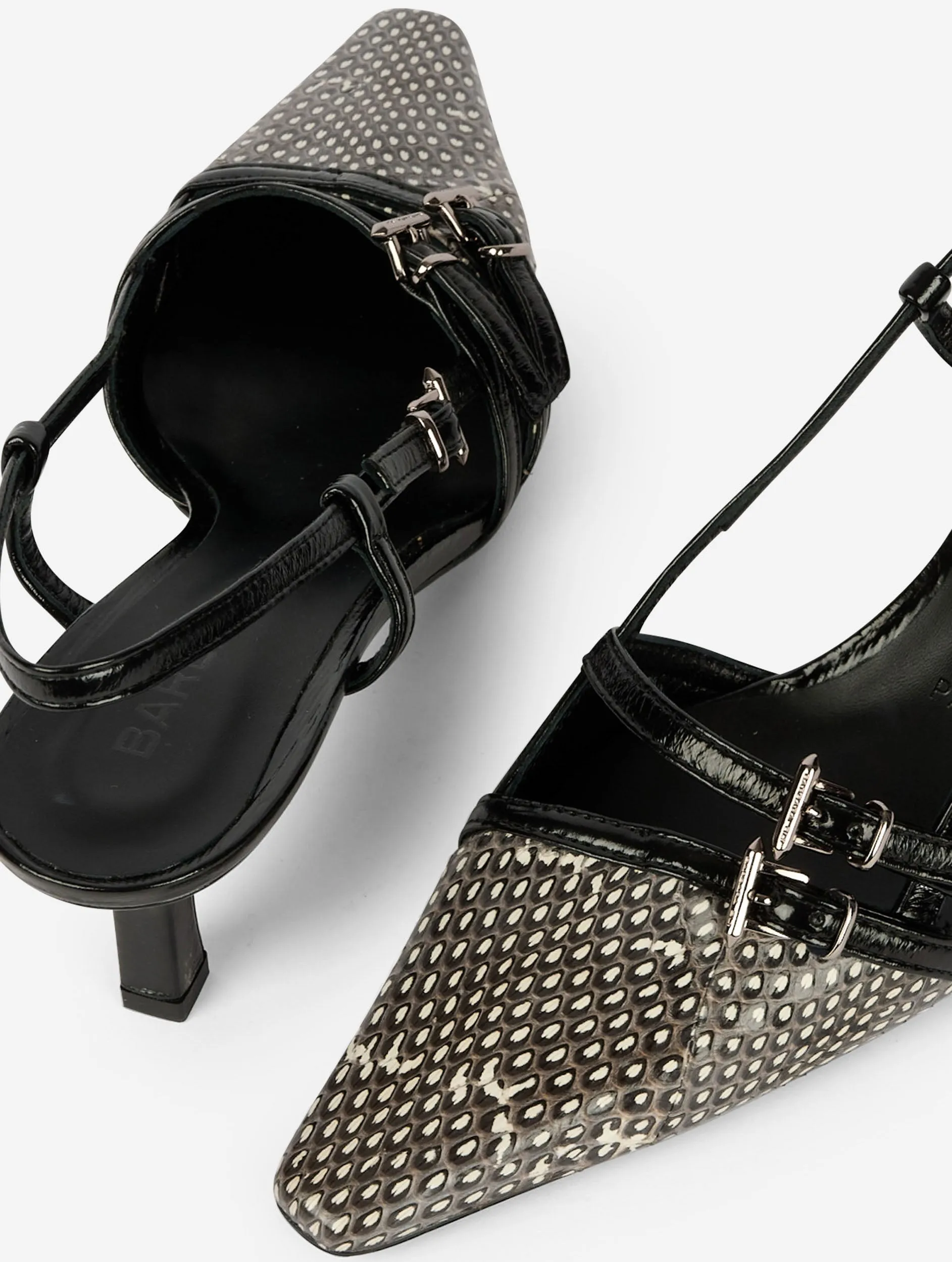 Black patent and ivory and black reptile slingback pumps